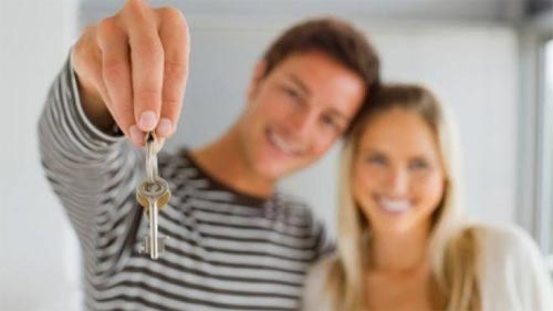 New homeowners with house keys
